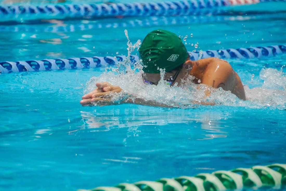 Focused swimmer in a pool during a race